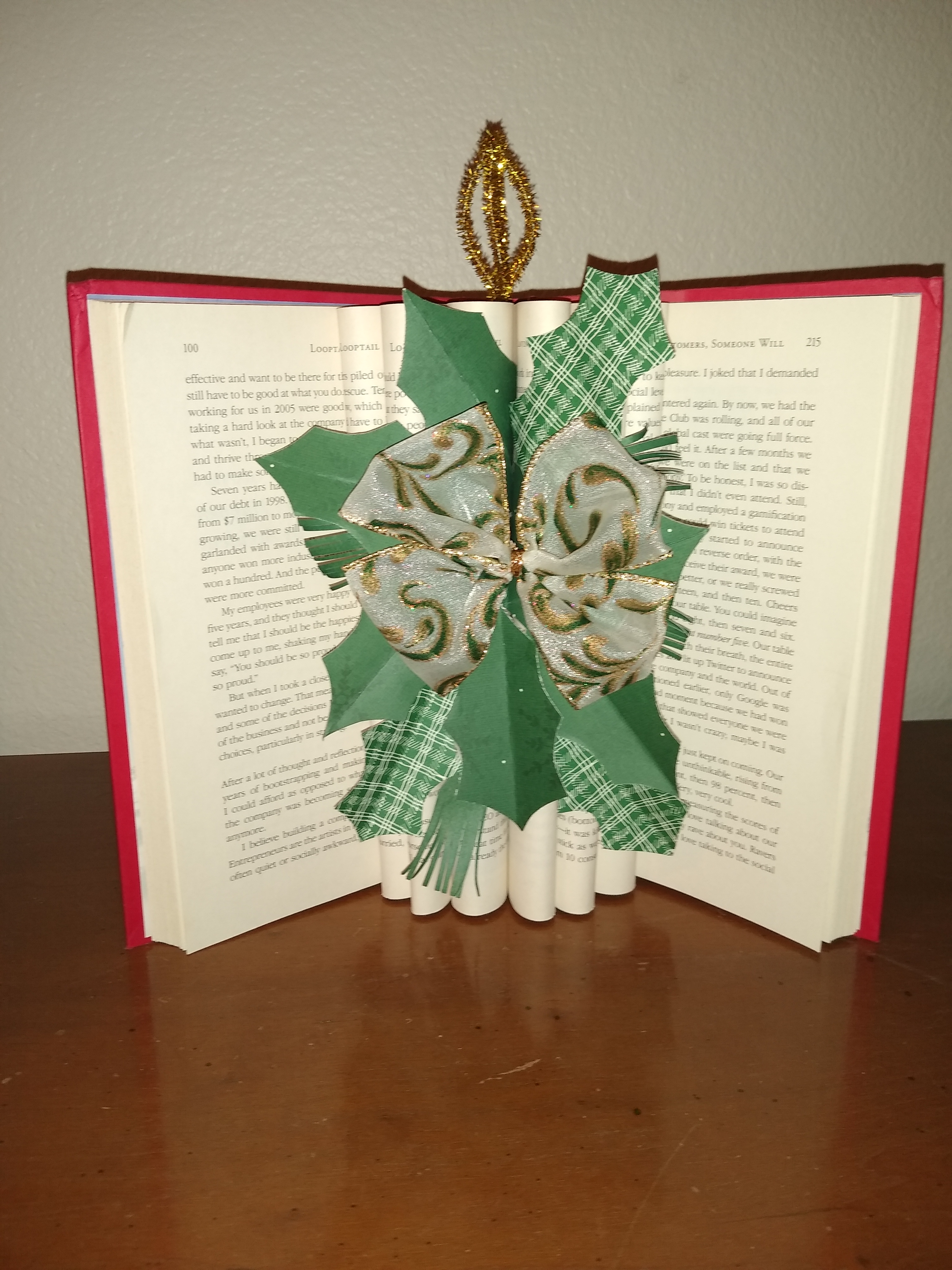open fluted book with decorations