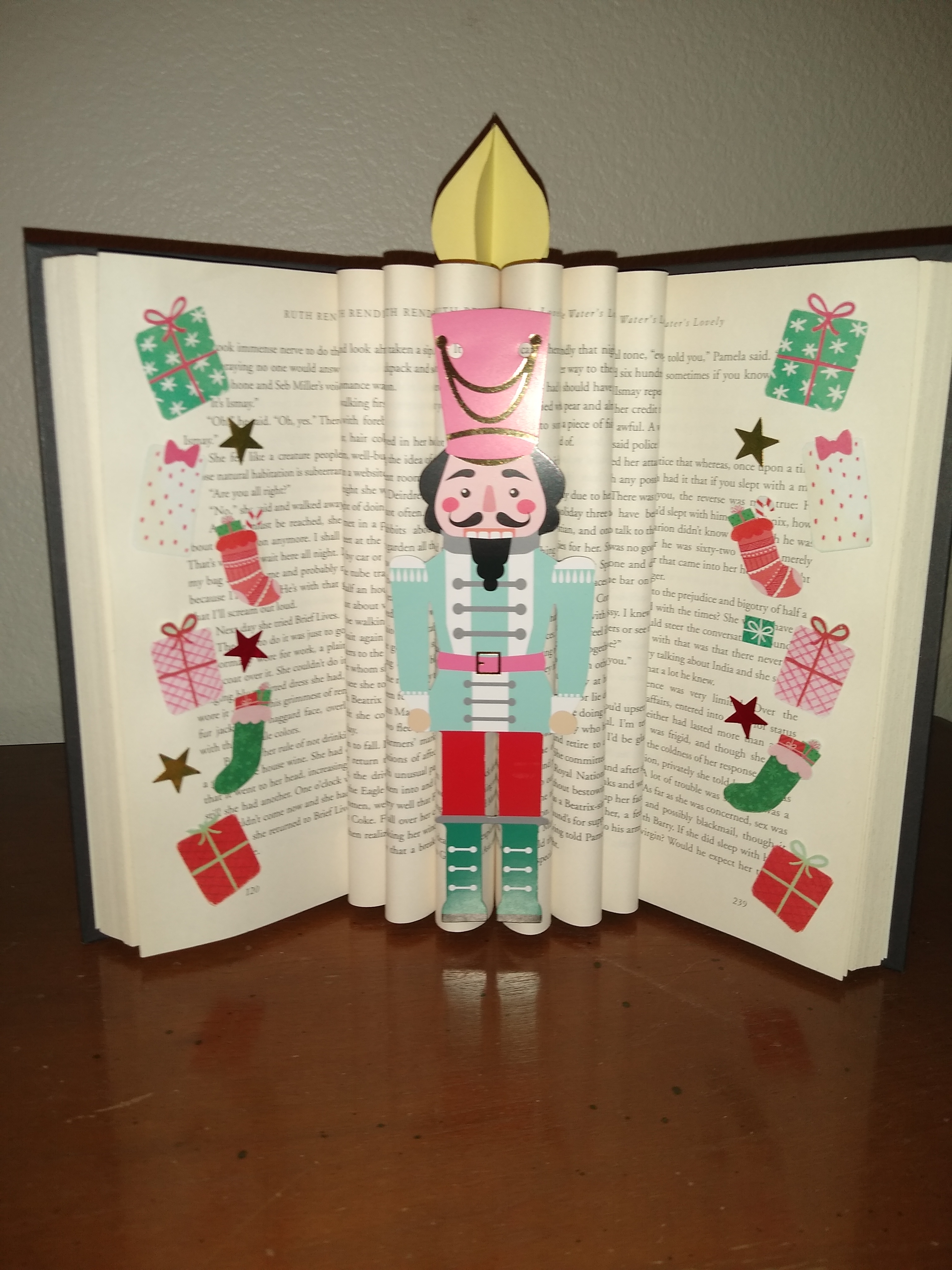 open fluted book with decorations