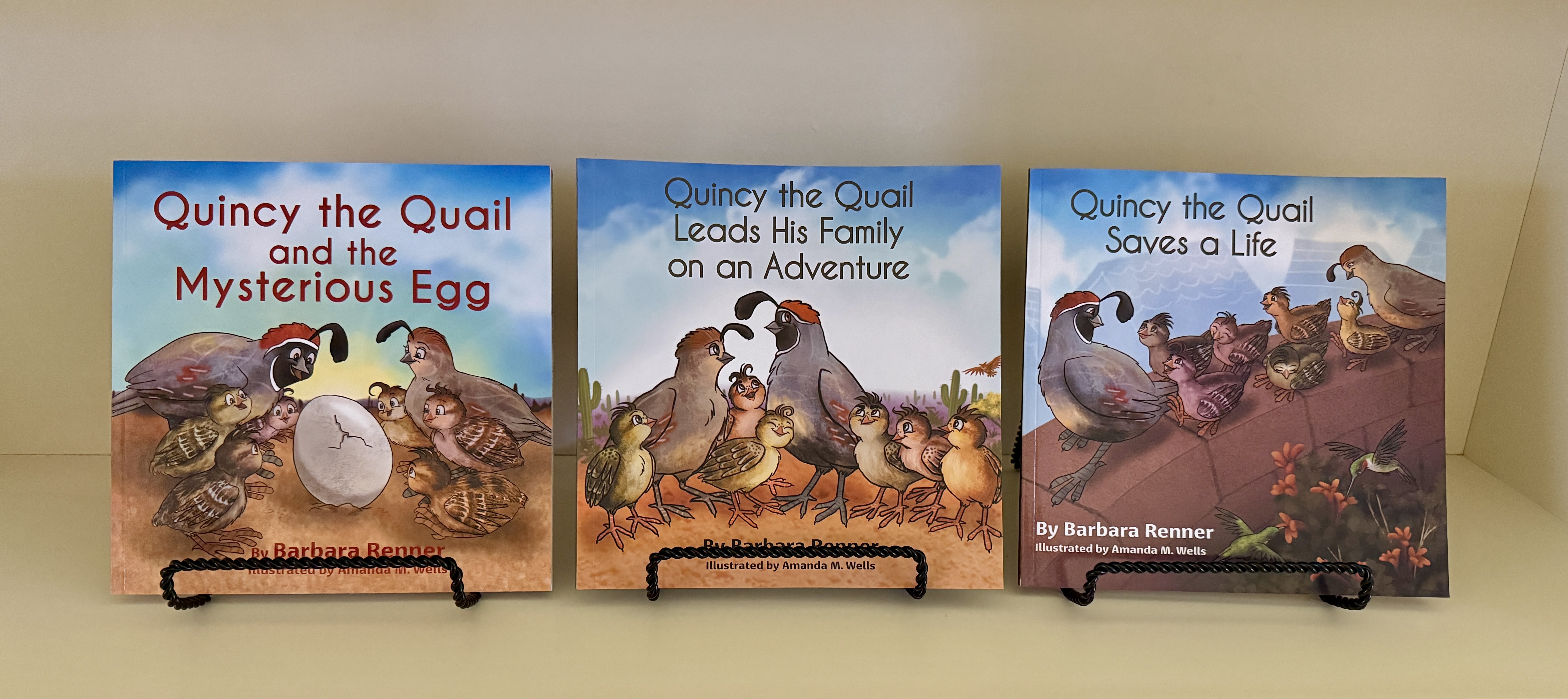 Three book covers with quails