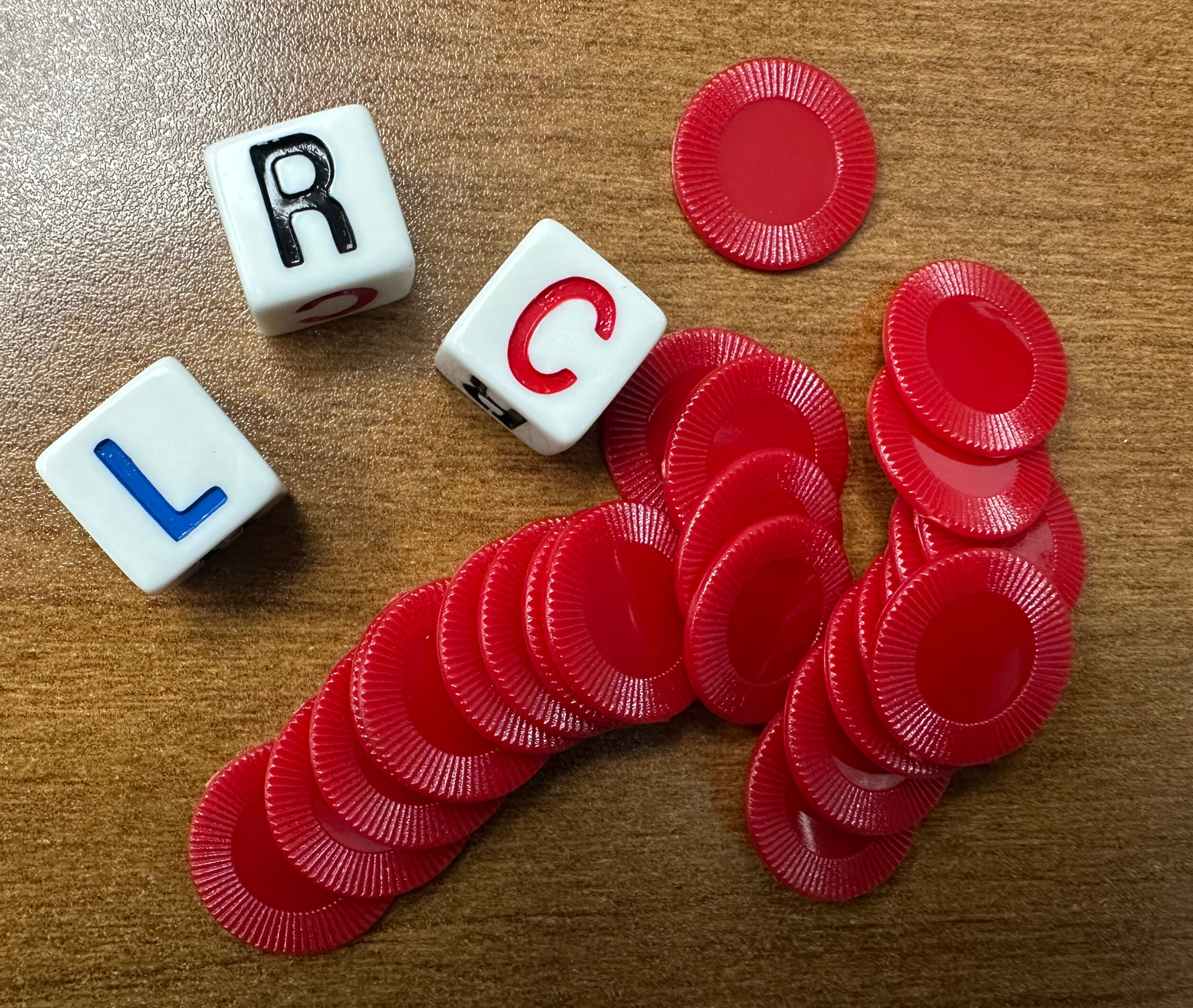 Dice L R C and red chips